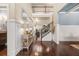 Elegant foyer with hardwood floors, wainscoting, and a grand staircase leading to the upper level at 229 Primstone Way, Mcdonough, GA 30253