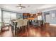 Open-concept kitchen with a large island, modern appliances, and a connected dining area at 229 Primstone Way, Mcdonough, GA 30253