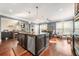 Bright kitchen with stainless appliances, granite counters, island, and an adjacent dining area at 229 Primstone Way, Mcdonough, GA 30253