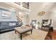 Open-concept living room with high ceilings, large windows, and comfortable seating at 229 Primstone Way, Mcdonough, GA 30253