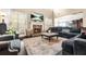 Cozy living room with fireplace, TV, and comfortable seating in a bright and open space at 229 Primstone Way, Mcdonough, GA 30253