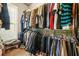 Spacious walk-in closet features an extensive wardrobe organization system, perfect for maximizing space and tidiness at 229 Primstone Way, Mcdonough, GA 30253