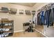Organized walk-in closet with shelving for shoes and storage baskets, and hanging space for clothing at 229 Primstone Way, Mcdonough, GA 30253
