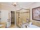 This bathroom features a glass enclosed shower, jetted tub and granite counters at 440 Canton Walk, Roswell, GA 30075