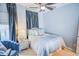 Bedroom with plush carpet, ceiling fan, and decorative sheer curtains at 440 Canton Walk, Roswell, GA 30075