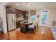 Modern kitchen with stainless steel appliances, granite countertops, island and hardwood floors at 440 Canton Walk, Roswell, GA 30075