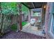 Brick patio with seating and lush landscaping offers an inviting outdoor retreat at 440 Canton Walk, Roswell, GA 30075