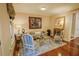 Sitting area with rug, neutral walls, hardwood floors, and contemporary furniture at 440 Canton Walk, Roswell, GA 30075