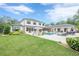 Lush backyard featuring a swimming pool, manicured lawn, and outdoor seating areas, perfect for relaxation at 6301 New Bethany Rd, Buford, GA 30518