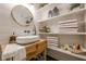 Stylish bathroom featuring shiplap walls, open shelving, a vessel sink, and modern fixtures at 6301 New Bethany Rd, Buford, GA 30518