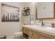 Well-lit bathroom with a bright white countertop, natural wood vanity, and a sleek mirror, creating a clean and inviting space at 6301 New Bethany Rd, Buford, GA 30518