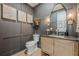 Tastefully designed powder room features modern fixtures, wooden accents, and decorative wall art at 6301 New Bethany Rd, Buford, GA 30518