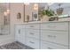 Bathroom vanity area featuring white cabinets, a white countertop, and bronze hardware at 6301 New Bethany Rd, Buford, GA 30518