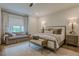 Bright, spacious bedroom with natural light, a comfortable seating area, and beautiful decor at 6301 New Bethany Rd, Buford, GA 30518