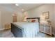 Nicely styled bedroom featuring a bed, stylish rug, and side tables with lamps at 6301 New Bethany Rd, Buford, GA 30518