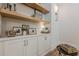 Elegant built-in storage with open shelves, lighting and stylish decor at 6301 New Bethany Rd, Buford, GA 30518