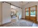 Bright entryway with barn doors leading to an office space at 6301 New Bethany Rd, Buford, GA 30518