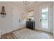 Hallway features wood floors, a window and built in shelves at 6301 New Bethany Rd, Buford, GA 30518