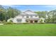 Beautiful two-story white home with black trim and expansive front lawn at 6301 New Bethany Rd, Buford, GA 30518