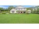 Charming two-story home with lush green lawn and mature landscaping at 6301 New Bethany Rd, Buford, GA 30518