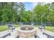 Cozy outdoor fire pit surrounded by comfortable seating, perfect for cool evenings and gatherings at 6301 New Bethany Rd, Buford, GA 30518