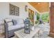 Relaxing front porch with cozy seating and stylish decor at 6301 New Bethany Rd, Buford, GA 30518