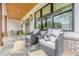 Comfortable front porch seating area with beautiful stone flooring at 6301 New Bethany Rd, Buford, GA 30518