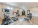 Well equipped home gym with a ceiling fan, a personal sauna and bright lighting, with wood-look floors at 6301 New Bethany Rd, Buford, GA 30518