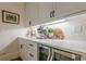 Wet bar with custom cabinets, quartz countertops and beverage cooler at 6301 New Bethany Rd, Buford, GA 30518