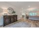Open-concept living area with hardwood floors and modern furnishings at 6301 New Bethany Rd, Buford, GA 30518