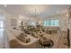 Open-concept living room with plenty of space, lots of seating, and elegant decor at 6301 New Bethany Rd, Buford, GA 30518