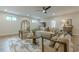 Well-lit living space featuring modern decor, a comfortable seating arrangement, and wood-look flooring at 6301 New Bethany Rd, Buford, GA 30518