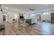 Spacious living room with wood flooring, modern furniture, a ceiling fan and plenty of natural light at 6301 New Bethany Rd, Buford, GA 30518
