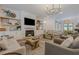 Cozy living room with fireplace, decorative shelves, and comfortable seating at 6301 New Bethany Rd, Buford, GA 30518
