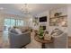 Spacious living room with fireplace, built-ins, and comfortable seating area at 6301 New Bethany Rd, Buford, GA 30518