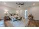 Inviting primary bedroom features plush bed, sitting area, and serene atmosphere at 6301 New Bethany Rd, Buford, GA 30518