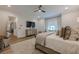 Bright main bedroom with a sitting area and access to an en suite bathroom at 6301 New Bethany Rd, Buford, GA 30518