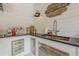 Elegant outdoor kitchen featuring granite countertops, stainless steel drawers, and a vintage sign at 6301 New Bethany Rd, Buford, GA 30518