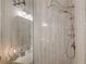 The updated shower features dual shower heads, sleek glass, and neutral colors at 6301 New Bethany Rd, Buford, GA 30518