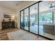 Bright sunroom with large sliding glass doors and elegant indoor/outdoor space at 6301 New Bethany Rd, Buford, GA 30518
