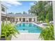 Stunning swimming pool area offering a peaceful oasis with greenery and outdoor seating at 6301 New Bethany Rd, Buford, GA 30518