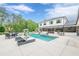 Expansive backyard features a sparkling pool, lounge chairs, and an outdoor dining area for entertainment at 6301 New Bethany Rd, Buford, GA 30518
