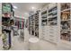 Bright, organized walk-in closet with custom shelving, shoe racks, and drawers for maximum storage at 6301 New Bethany Rd, Buford, GA 30518