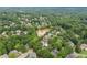 Aerial view of homes backing onto a small lake, providing scenic views and a connection with nature at 9595 Rod Rd, Alpharetta, GA 30022