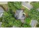 Aerial view of a beautiful home surrounded by lush greenery, showcasing its prime location and spacious lot in a neighborhood at 9595 Rod Rd, Alpharetta, GA 30022