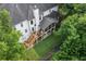 Aerial view reveals home's backyard oasis with screened porch, complemented by lush trees, offering privacy and outdoor enjoyment at 9595 Rod Rd, Alpharetta, GA 30022