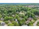 Aerial view of homes nestled in a lush green neighborhood, showcasing a peaceful and private residential area at 9595 Rod Rd, Alpharetta, GA 30022