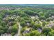 Expansive aerial view of a neighborhood with mature trees and well-maintained homes in a suburban setting at 9595 Rod Rd, Alpharetta, GA 30022