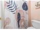 Modern bathroom with a decorative shower curtain and white fixtures at 9595 Rod Rd, Alpharetta, GA 30022