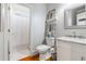 Bathroom features a single sink, a shower with patterned tile and hard wood floors at 9595 Rod Rd, Alpharetta, GA 30022